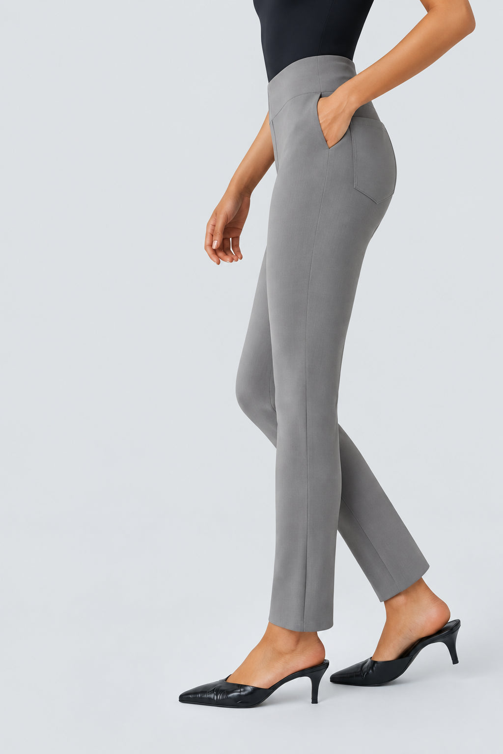 A model wearing slim-fit gray pants with side pockets, paired with black pointed mule heels, shown against a light gray background with promotional text on the left.