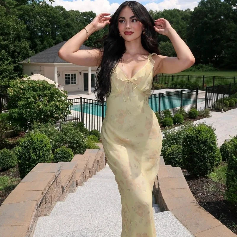 Abito lungo senza schienale con scollo profondo e motivo floreale