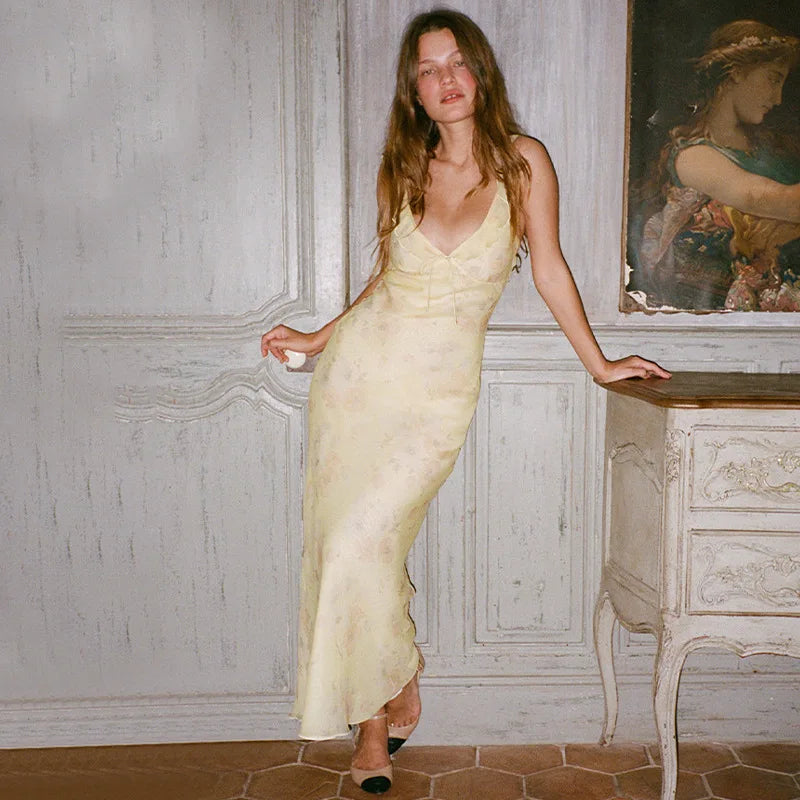 Abito lungo senza schienale con scollo profondo e motivo floreale